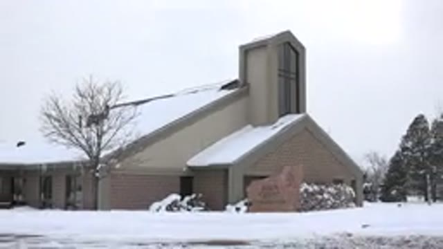 ARVADA COLORADO-2015: A Taupe Colored Church Building On A Snowy Day With Fresh Snow