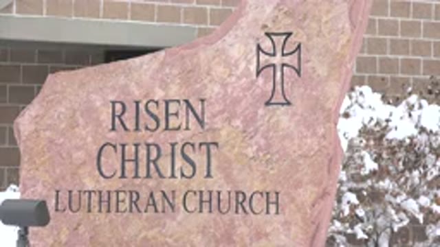ARVADA COLORADO-2015: A Plate Beside A Brick Church Exterior