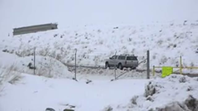 ARVADA COLORADO-2015: A Car Driving on a Snow-Covered Road in Winter