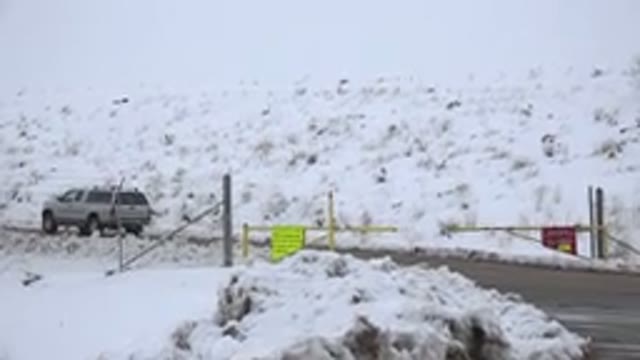 ARVADA COLORADO-2015: Barrier Closed On A Road And A Car Moving Along Surrounded