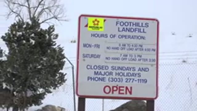 ARVADA COLORADO-2015: Sign Showing The Hours Of Operation For A Landfill Opening