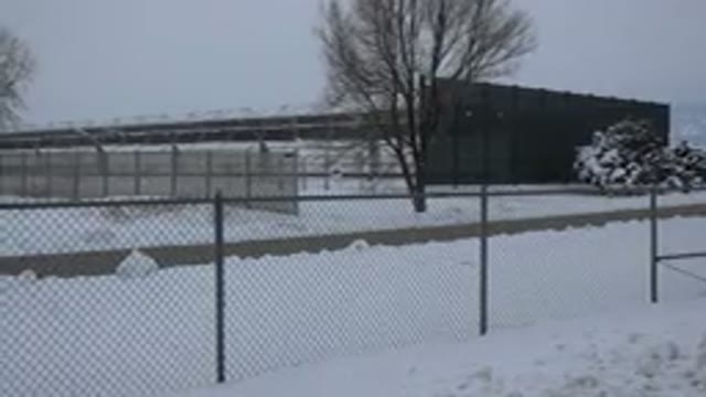 ARVADA COLORADO-2015: Panning Shot Of Fenced Area With Trees And Snow