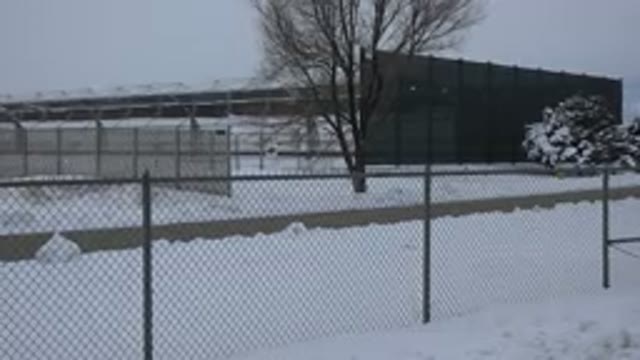 ARVADA COLORADO-2015: Fenced Area During Winter With Snow And Trees And Road