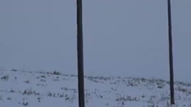 ARVADA COLORADO-2015: Telephone Wires Along A Snow Covered Hill