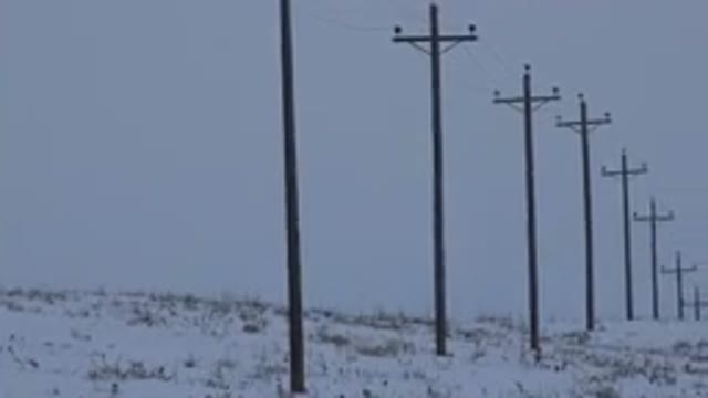 ARVADA COLORADO-2015: Line Of Telephone Posts Getting Lost In The Horizon Over A