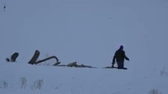 ARVADA COLORADO-2015: Man Walking Through Snow-Covered Field