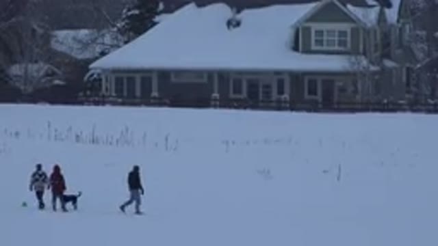ARVADA COLORADO-2015: Person Wearing White And Black Coat Throws Object On A