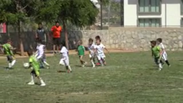 SAN JOSE DEL CABO MEXICO-2019: Kids Playing Soccer On Green Field On A Bright
