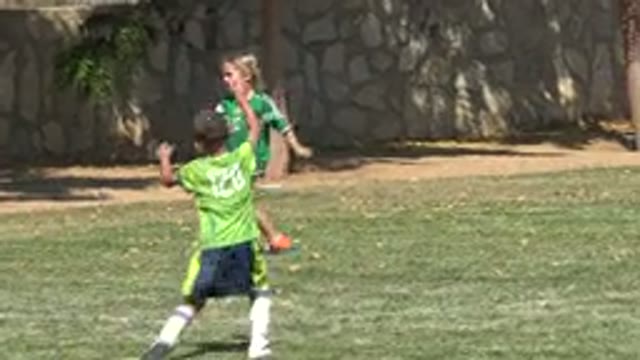SAN JOSE DEL CABO MEXICO-2019: Girl Wearing Green Shirt And Orange Shoes Walks