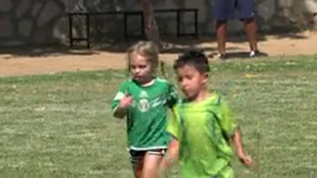 SAN JOSE DEL CABO MEXICO-2019: Little Kids Play Soccer On A Grass Field