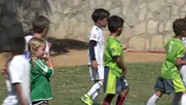 SAN JOSE DEL CABO MEXICO-2019: Little Kids Playing Soccer Game in a Grass Camp