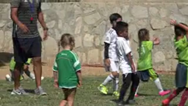 SAN JOSE DEL CABO MEXICO-2019: Young Children Playing Soccer Outside On A Warm