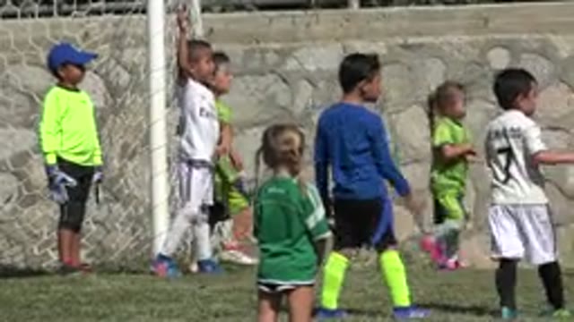 SAN JOSE DEL CABO MEXICO-2019: Group Of Kids Standing On Green Grass On A Bright