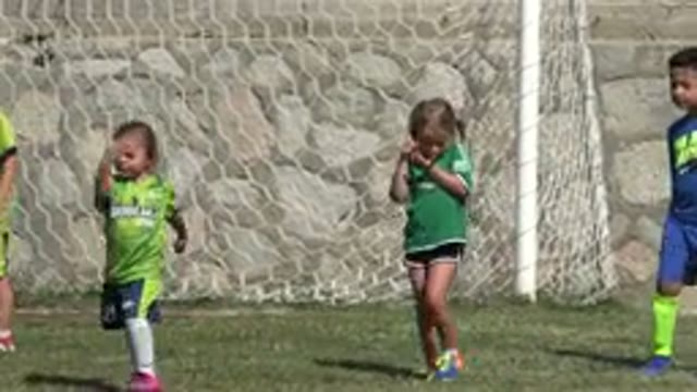SAN JOSE DEL CABO MEXICO-2019: Little Energetic Kids Play Soccer on Grass Field