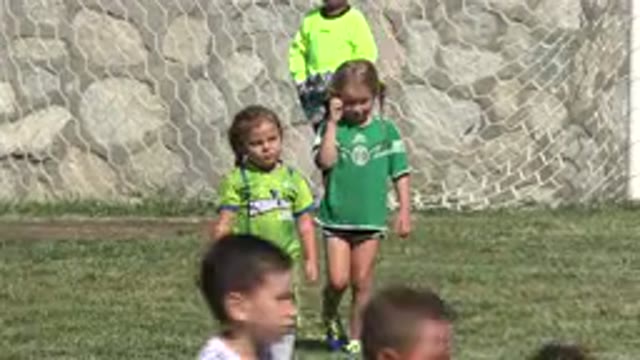 SAN JOSE DEL CABO MEXICO-2019: Energetic Little Kids Playing Soccer On Grass
