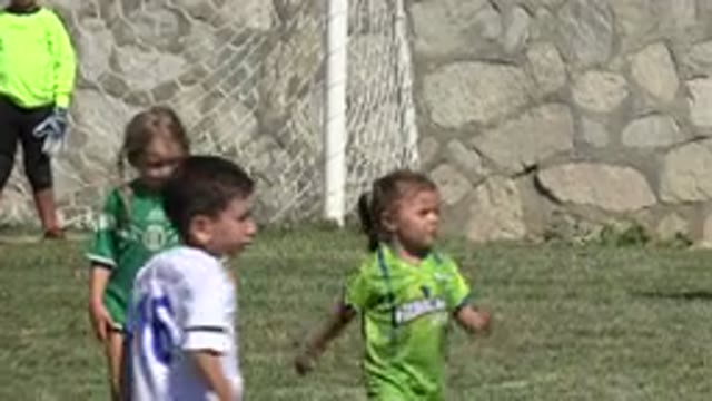 SAN JOSE DEL CABO MEXICO-2019: Kids Playing Soccer On A Green Grass Field