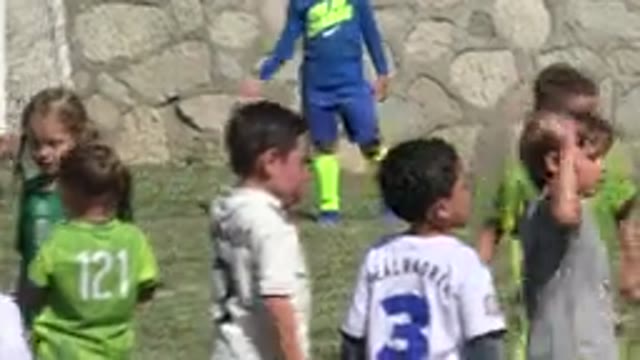 SAN JOSE DEL CABO MEXICO-2019: Boy Wearing Green Shirt With Blue Shorts Claps
