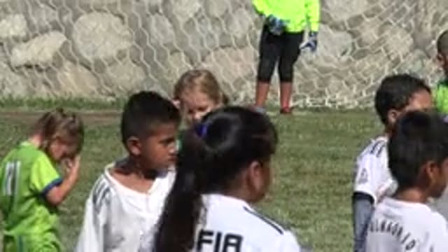 SAN JOSE DEL CABO MEXICO-2019: Young Children Boys and Girls Playing Soccer on a Grass Field