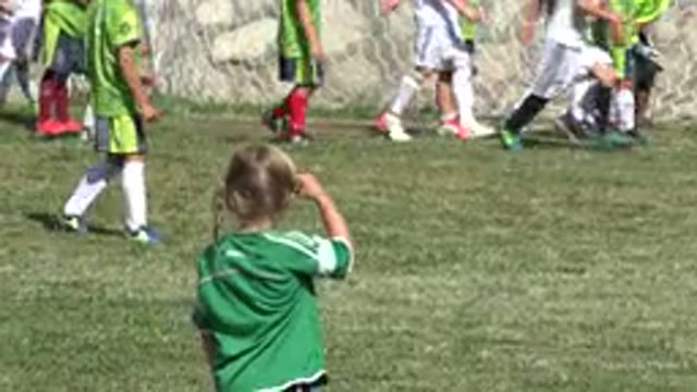 SAN JOSE DEL CABO MEXICO-2019: Little Girl Watches Her New Friends Warm Up For