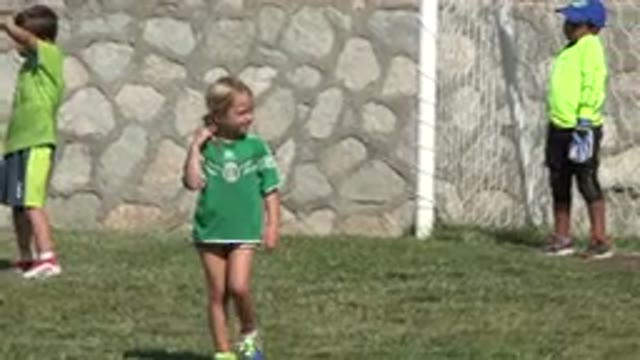 SAN JOSE DEL CABO MEXICO-2019: Small Girl With A Green Shirt Wanders Around The Field