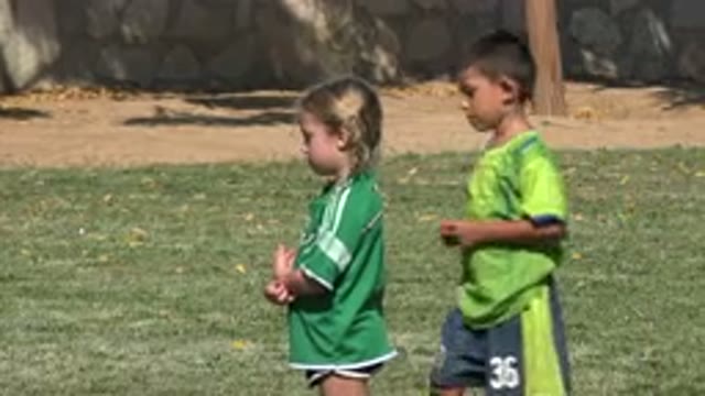 SAN JOSE DEL CABO MEXICO-2019: A Depressed Blonde Girl in a Green Soccer Jersey