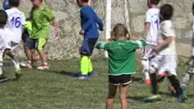 SAN JOSE DEL CABO MEXICO-2019: A Bunch Of Kids On A Field Playing Soccer With A