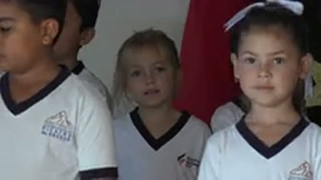 SAN JOSE DEL CABO MEXICO-2019: Girl Wearing White Shirt Stands Near Red Object