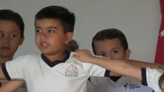 SAN JOSE DEL CABO MEXICO-2019: Children Sing And Sway In Unison With Arms Linked