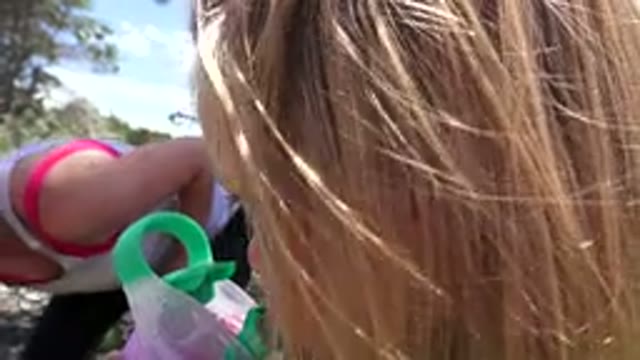 WESTMINSTER COLORADO-2016: A Little Blonde Haired Girl Sips From A Pink Sippy