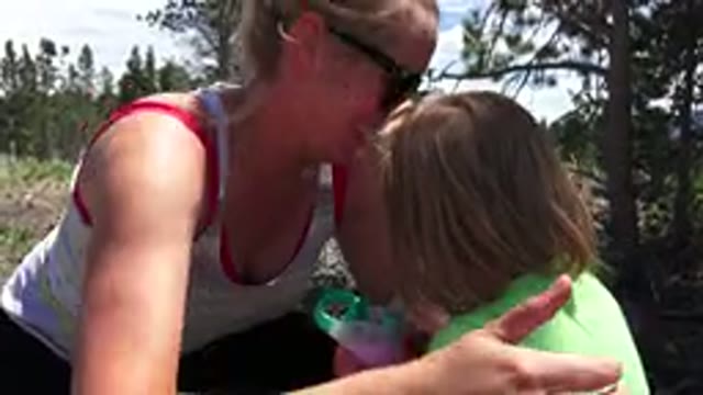 WESTMINSTER COLORADO-2016: Thirsty Little Girl Drinking Cold Juice in Garden