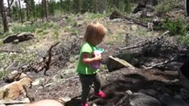 WESTMINSTER COLORADO-2016: Little Girl Struggling To Climb Rocks In Rural