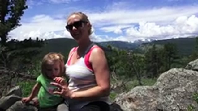 WESTMINSTER COLORADO-2016: A Woman And A Small Girl Sitting On The Rocks In The