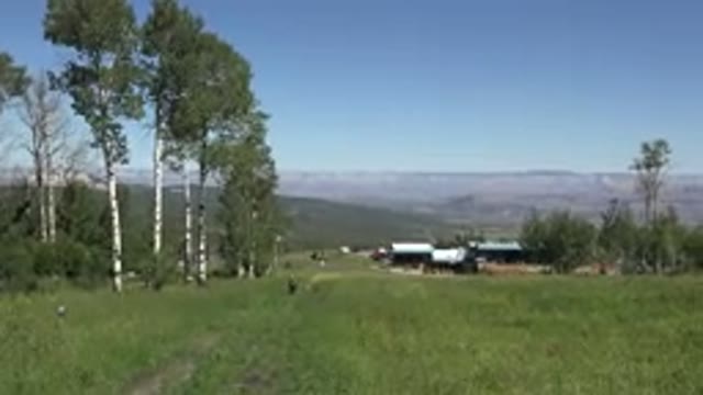 MESA COLORADO-2016: A House In The Foreground With Fields And Mountains In The Background