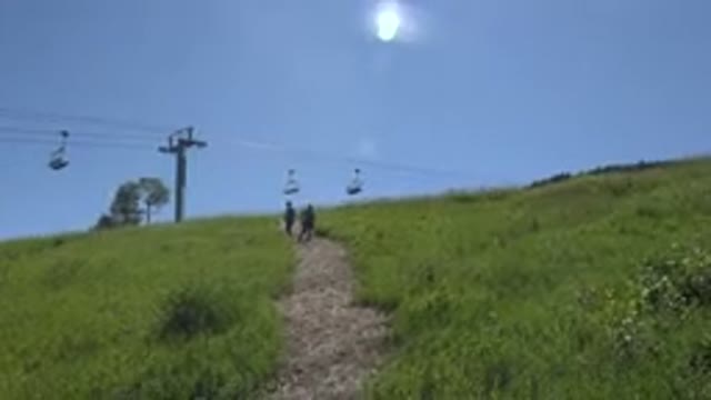 MESA COLORADO-2016: Chair Lift High Above A Hilly Path On A Bright Sunny Summer