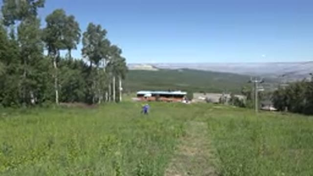 MESA COLORADO-2016: Men Walking In The Distance Through The Tall Grass On A