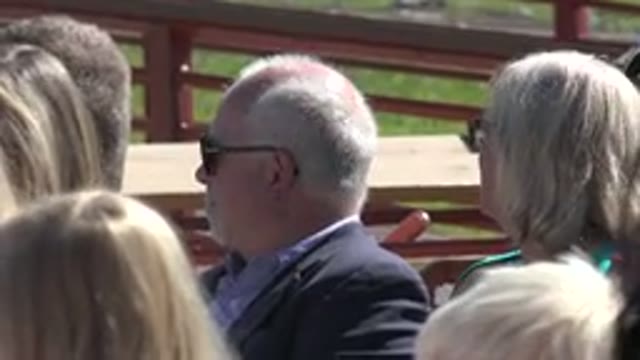 MESA COLORADO-2016: Man Wearing Blue Shirt And Sunglasses Sits Next To Woman