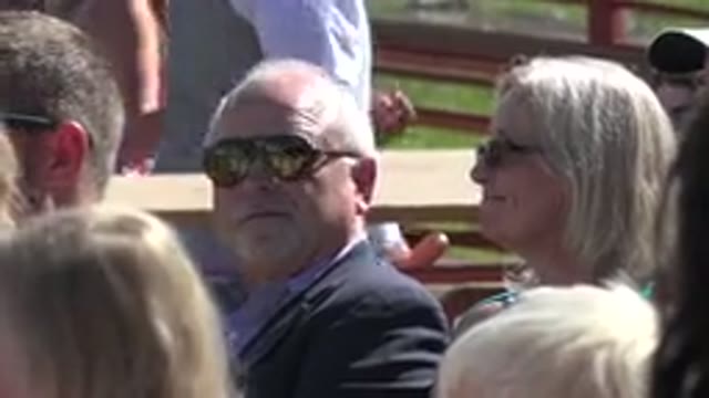 MESA COLORADO-2016: A Man And A Woman Wearing Sunglasses In The Middle Of A Sunny Gathering