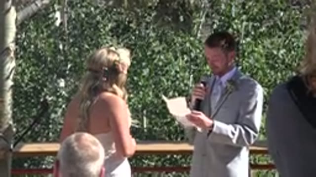 MESA COLORADO-2016: Man Wearing Grey Suit Reads From White Piece Of Paper On A