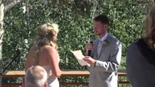 MESA COLORADO-2016: Man Wearing Grey Suit Reads From White Piece Of Paper On A