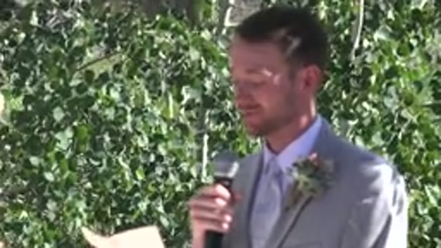 MESA COLORADO-2016: Excited Groom Talking To The Bride In Nature Holding A Microphone And Paper