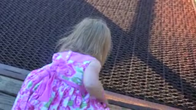 MESA COLORADO-2016: Young Girl Bending Over To Pick Something Up Before One Of