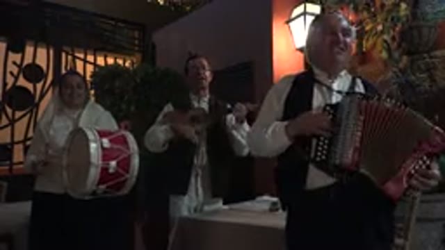 MADIERA PORTUGAL-2016: Three Men Wearing White Shirts Play Instruments In