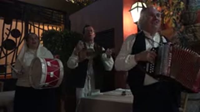 MADIERA PORTUGAL-2016: Three Old Men Playing Instruments In A Restaurant