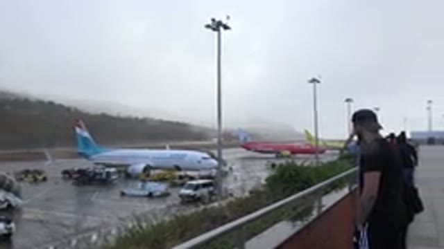MADIERA PORTUGAL-2016: Airplane Airport With Person In Overview And Cars