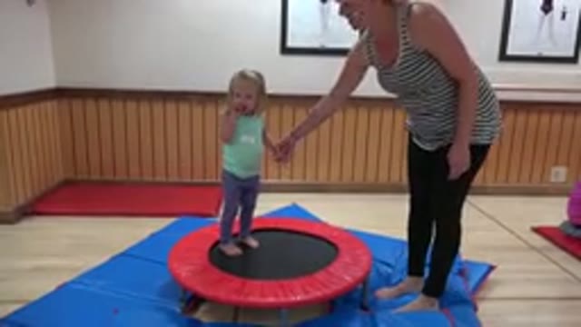 WESTMINSTER COLORADO-2016: A Blonde Woman Holding A Blonde Girl Jumping On A