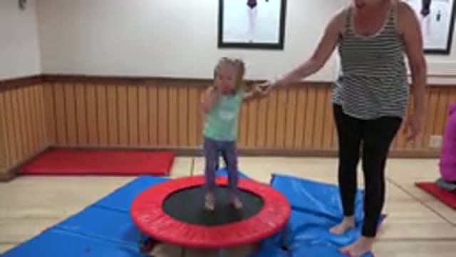 WESTMINSTER COLORADO-2016: Small Child Jumping On The Trampoline Holding Her Grandmother's Hand