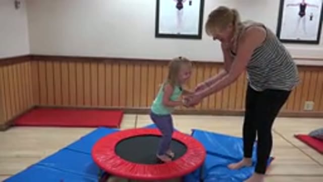 WESTMINSTER COLORADO-2016: Young Child Bouncing on Trampoline as Mother Watches