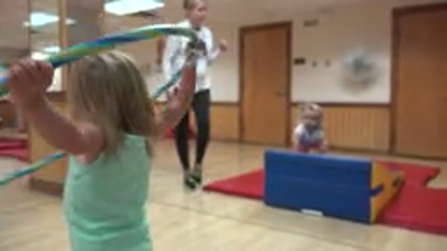 WESTMINSTER COLORADO-2016: Kid Playing Gym in Bed Near Beach with Mother