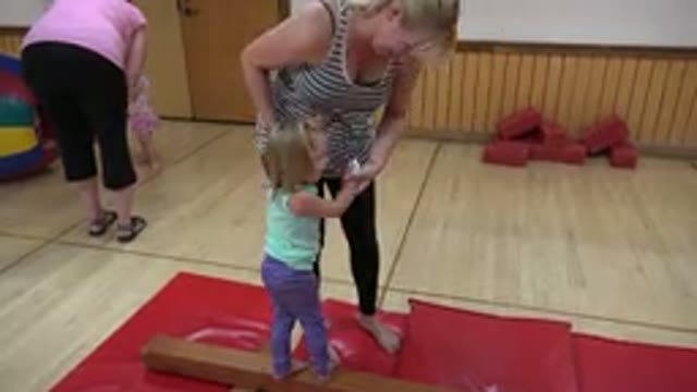 WESTMINSTER COLORADO-2016: Little Girl Learning To Walk With Her Mother In A Gym