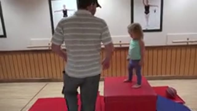 WESTMINSTER COLORADO-2016: Father Helping His Daughter To Jump Off A Sofa While